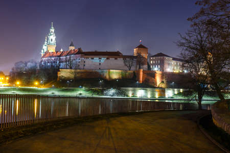 Wawel Castle in the evening in Krakow with reflection in the river, Poland. Long time exposureのeditorial素材