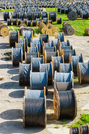electricity cable on wooden spools on the floorの写真素材