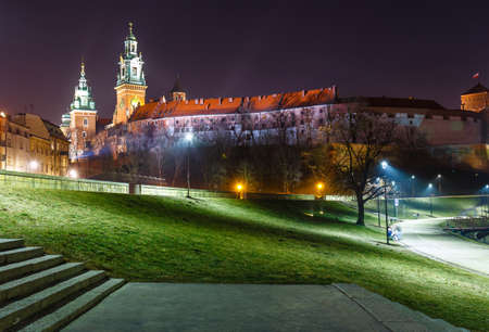 Wawel Castle in the evening in Krakow with reflection in the river, Poland. Long time exposureのeditorial素材