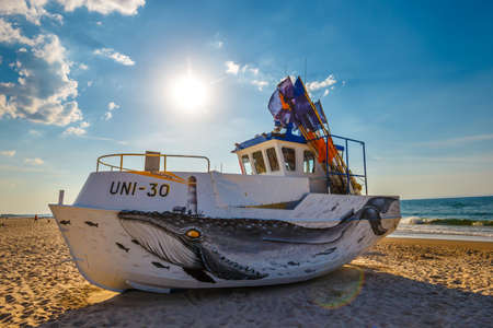 Uniescie, Poland, May 28, 2018: fishing boat painted in fanciful shapes like an octopus and a whaleのeditorial素材