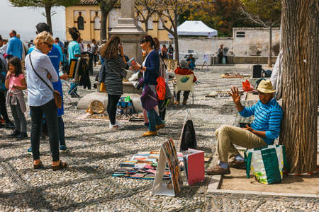 Granada, Spain, April 06, 2018:  Crowded plaza of Saint Nicholas situated in the distric of Albaicin in the Old Town of Granada, Andalusia, Spain.のeditorial素材