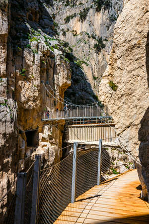 Caminito Del Rey, Spain, April 04, 2018:  Visitors crossing the suspension bridge at Gaitanes Gorge, Malaga, Spainのeditorial素材