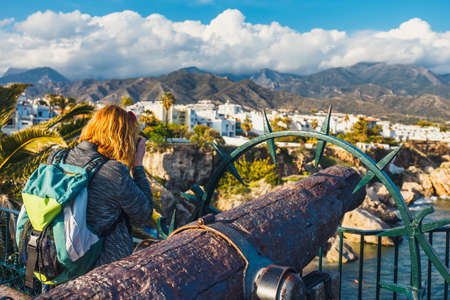 Seascape with ancient cannon on Playa Carabeillo beach in Nerja, Costa del Sol, Spainの写真素材