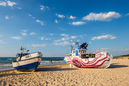 Uniescie, Poland, May 28, 2018: fishing boat painted in fanciful shapes like an octopus and a whaleのeditorial素材