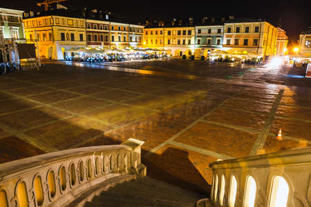 Zamosc, Poland - September 01, 2018: Great Market Square at night. Example of a Renaissance town in Central Europe, founded in 1580 by the Jan Zamoyskiのeditorial素材