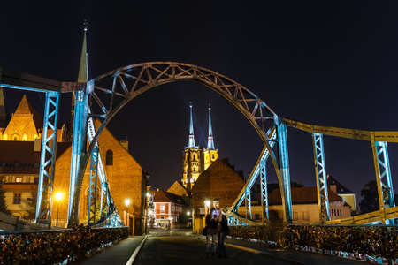 Wroclaw, Poland, October 06, 2018: Night view of church of the Holy Cross and St Bartholomew and cathedral of saint john the baptist in Wroclaw, Polandのeditorial素材