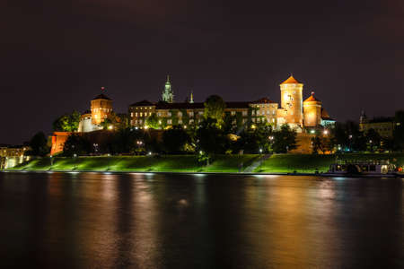 Wawel Castle in the evening in Krakow with reflection in the river, Poland. Long time exposureのeditorial素材