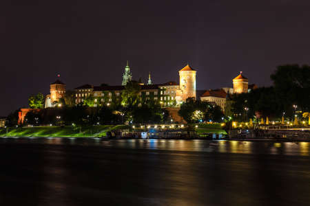 Wawel Castle in the evening in Krakow with reflection in the river, Poland. Long time exposureのeditorial素材