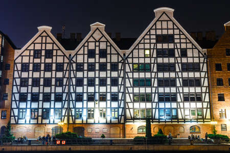 scenic view of Motlawa river embankment in historical part of Gdansk at night, Polandのeditorial素材