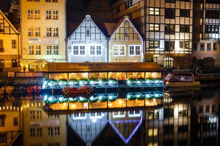 Gdansk, Poland, October 13, 2018: scenic view of Motlawa river embankment in historical part of Gdansk at night, Polandのeditorial素材