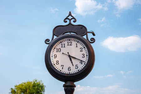 town clock on blue sky background, close upの写真素材