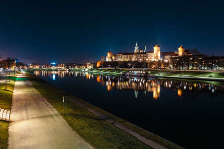 The Royal Wawel Castle as seen from another bank of Vistula. Krakow is the most famous landmark in Poland. Night viewのeditorial素材