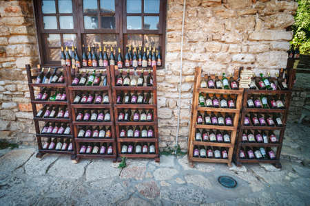 Balchik, Bulgaria, July 07, 2013: Dusty bottles of wine in the garden of the Balchik Palace, Bulgariaのeditorial素材
