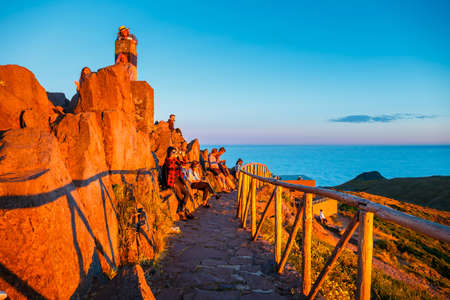 Madeira Island, portugal, July 04, 2016: a group of people admires the beautiful sunset, Pico de Arieiroのeditorial素材