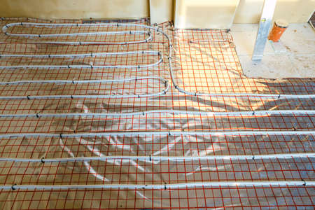 Close up on water floor heating system interiorの写真素材