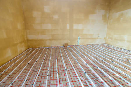 Close up on water floor heating system interiorの写真素材