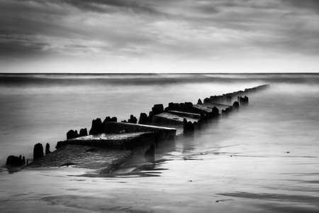 Long exposure shot of the sea and a pier, black and white photo, Baltic Sea, Polandの写真素材