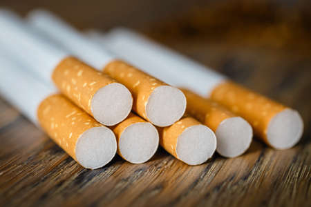 Close up of a hndmade smoking cigarettes on wooden background