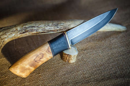 Hunter combat hand made knife and deer antlersの写真素材