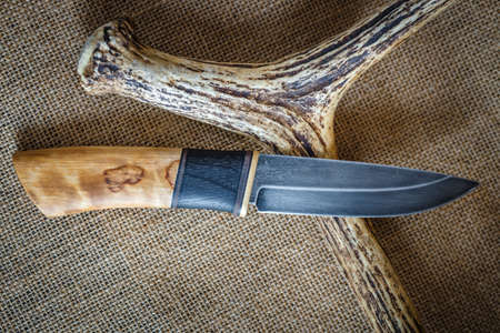 A sharp knife with a wooden handleの写真素材