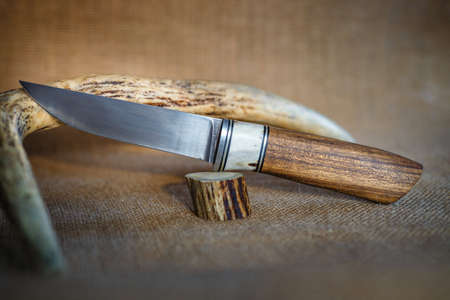 hunting knife handmade on a brown backgroundの写真素材