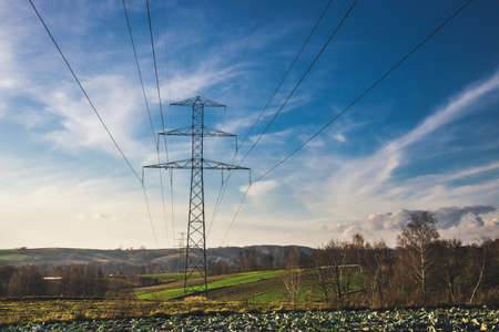 High voltage electric pillars against the skyの写真素材
