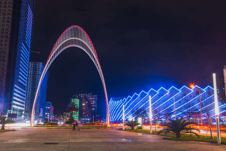Batumi, Georgia - October 01, 2021: Modern architecture of Batumi embankment at night. Evening view of the modern hotel complex Orbi City in the city of Batumiのeditorial素材