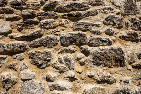 brown stone wall texture closup backgroundの写真素材