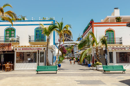 Puerto de MogÃ¡n, Gran Canaria, Spain. 18 July 2022: Narrow and flowery streets of Puerto de Mogan are eagerly visited by touristsのeditorial素材