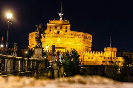 Castel Sant Angelo by night. Mausoleum of Hadrian in Rome Italy, built in ancient Rome, it is now the famous tourist attraction of Italy.の写真素材