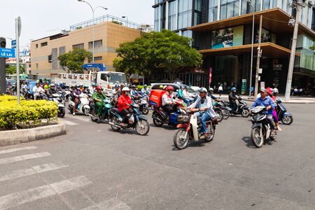 Ho Chi Minh City (Saigon), Vietnam - march 7 2017: heavy traffic on the crossroad. Scooter is most popular mean of transport in Vietnam.のeditorial素材