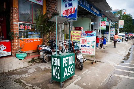 Phong Nha, Vietnam - March 8 2017: operated gasoline station on a sidewalk is the most popular way to buy gasoline on rural areas.のeditorial素材