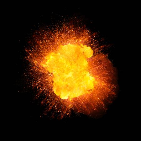 Realistic fire explosion, orange color with sparks isolated on black backgroundの写真素材
