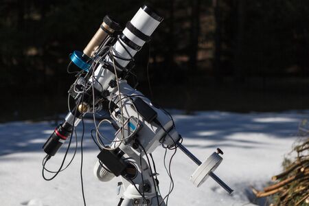 Professional astrophotography telescope equipped with guider scope and astro camera ready for night sessionの写真素材