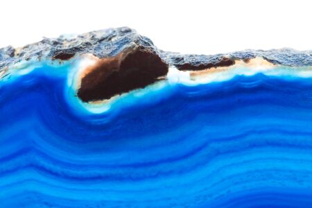 Abstract background - blue agate mineral cross section isolated on white backgroundの写真素材