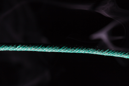 Green fuse on black background