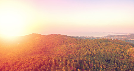 Aerial view of sunset over mountain jungleの写真素材