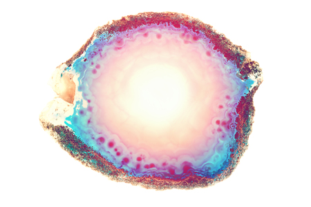 Abstract background, round blue and orange sunrise reflection effect agate slice mineral isolated on whiteの写真素材