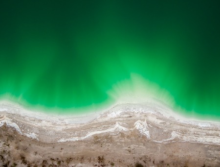 Azure lake top view, abstract fantasy green and brown pattern backgroundの写真素材