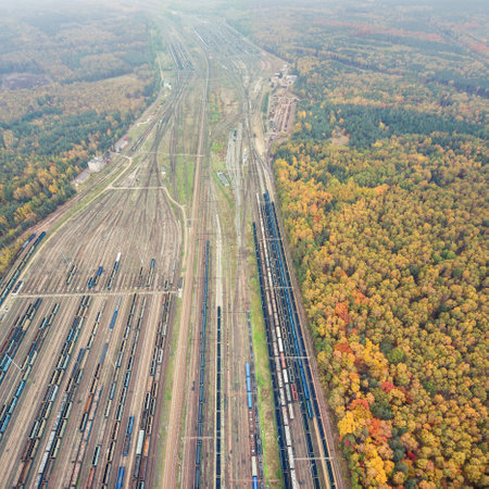 Autumn forest and railway depot aerial viewの写真素材