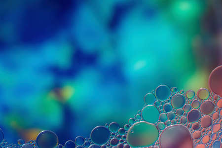 Fantasy colorful blurry background with ornament made of soft clear bubbles, abstract color splashes with copy space, focus on foregroundの写真素材