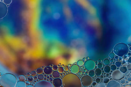 Fantasy colorful blurry background with ornament made of soft clear bubbles, abstract color splashes with copy space, focus on foregroundの写真素材