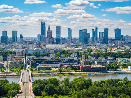 Swietokrzyski bridge and skyscrapers in city center, Warsaw aerial landscape under blue skyの写真素材