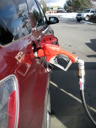 SPOKANE/WASHINGTON STATE /USA _Consumer pumping gasoline from costco gasoline  station 7 Mach 2011   のeditorial素材