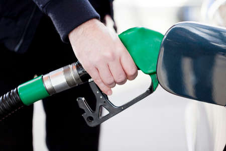 filling up the car with petrol at the gas station