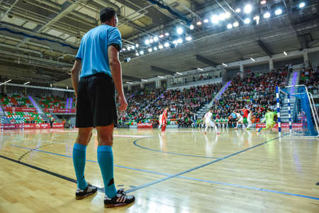 LUBIN, POLAND -  DECEMBER 2, 2019: Futsal friendly match Poland vs Serbia 4:1. Ball on the referee's table. Referee on the sideline.のeditorial素材