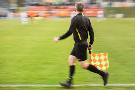 Assistant referee during football match - panning technique shotの写真素材