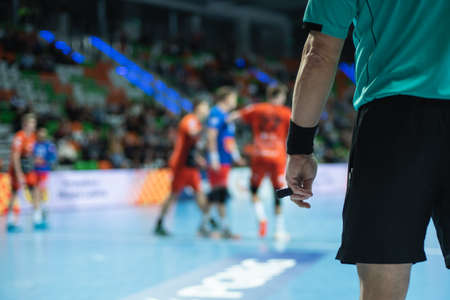 Handball referee hand with whistleの写真素材