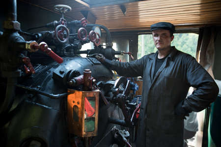 Portrait machinist assistant of a steam locomotiveの写真素材