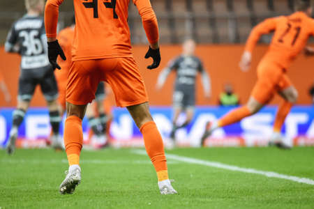 Detail of player's legs during football matchの写真素材